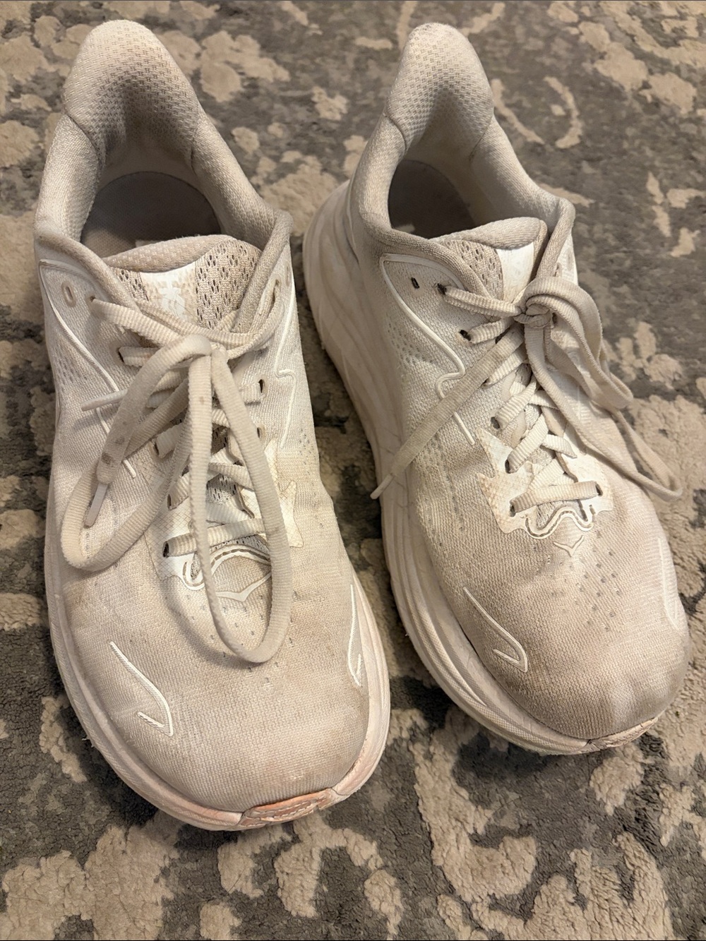Well worn Hoka sneakers